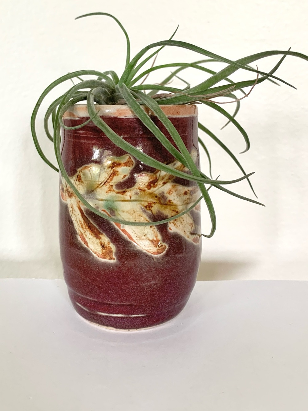 handmade burgundy beige small ceramic vase with leaf imprint